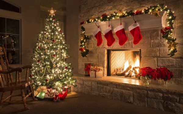A cozy HD Christmas wallpaper featuring a decorated tree with lights and ornaments, a stone fireplace adorned with stockings, holiday gifts, and a warm festive atmosphere.