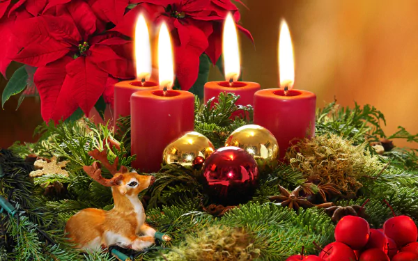A vibrant 4K Ultra HD Christmas desktop wallpaper featuring lit red candles, a small deer figurine, poinsettias, holiday ornaments, and festive greenery.