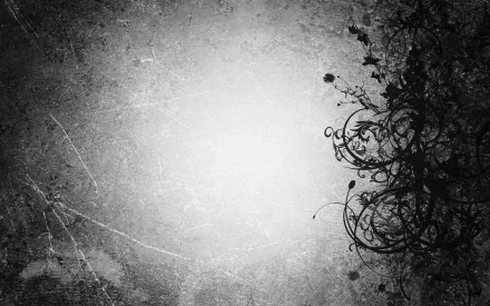 A greyscale abstract HD desktop wallpaper featuring a textured black background with swirling floral patterns on the right side.