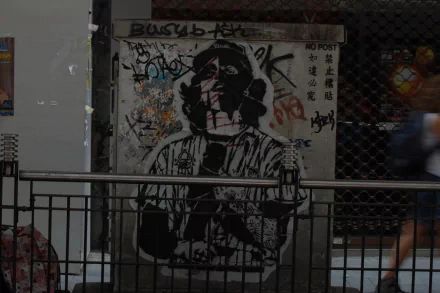 Artistic graffiti on an urban wall featuring a monochrome portrait, presented as an HD PC desktop wallpaper and background.
