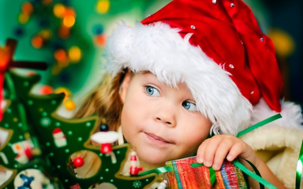 Holiday Christmas Child Face Santa Hat Blue Eyes HD Wallpaper | Background Image