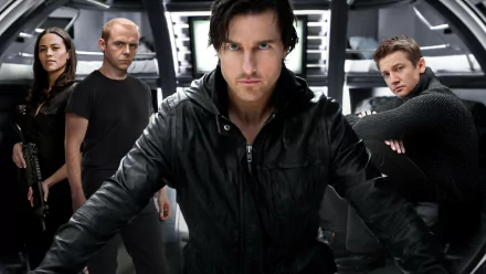 HD PC desktop wallpaper featuring Tom Cruise and cast from the movie Mission: Impossible - Ghost Protocol in a high-tech, intense action scene.