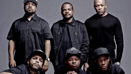 HD desktop wallpaper featuring the cast of Straight Outta Compton posing in dark clothing against a grey background.