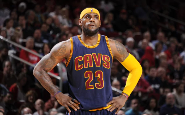 HD wallpaper of a basketball player in a Cleveland Cavaliers jersey number 23, standing confidently on the court.