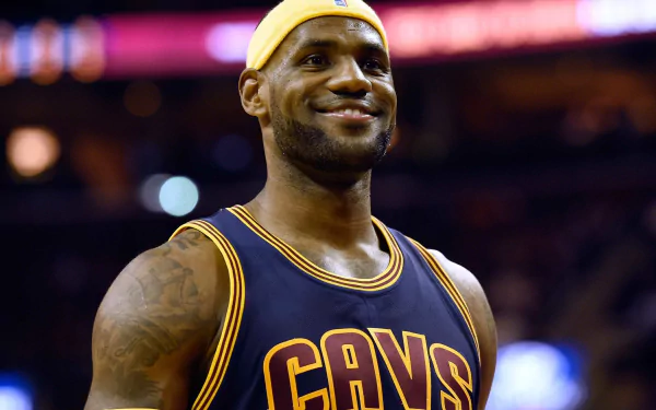 HD desktop wallpaper featuring a smiling basketball player in a Cleveland Cavaliers jersey, suitable as a background.