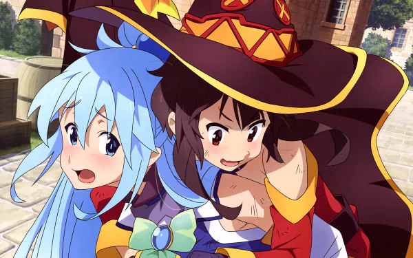 Megumin and Aqua from KonoSuba are captured in a playful moment. This HD desktop wallpaper features the two characters from the anime KonoSuba - God’s Blessing on This Wonderful World!! against a vibrant outdoor backdrop.