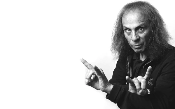 HD black and white PC desktop wallpaper of Dio, the iconic musician, making a rock hand gesture against a plain background.