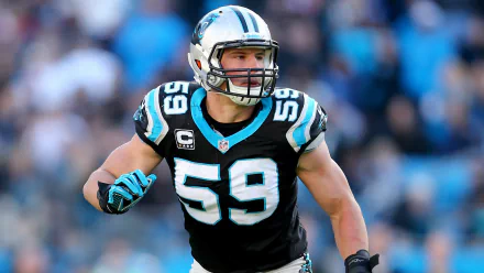 High-definition desktop wallpaper featuring Luke Kuechly, the former NFL linebacker, in his iconic Carolina Panthers uniform, showcasing his dynamic action on the field.