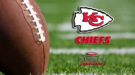 Close-up of an NFL football on grass with the Kansas City Chiefs logo and the word CHIEFS alongside Arrowhead text in this 4K Ultra HD desktop wallpaper.