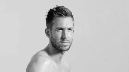 HD desktop wallpaper featuring a monochrome portrait of a shirtless man posing against a neutral background.