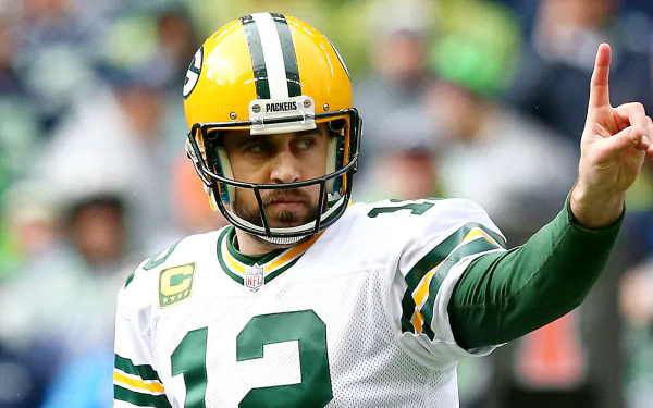 HD desktop wallpaper featuring Aaron Rodgers in his Green Bay Packers jersey, number 12, giving a one-finger salute on the field.