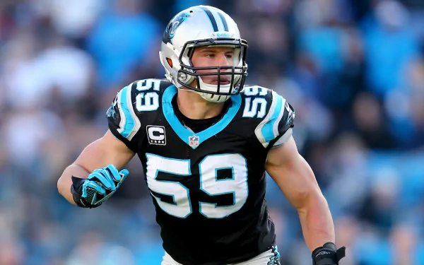 High-definition desktop wallpaper featuring Luke Kuechly, the former NFL linebacker, in his iconic Carolina Panthers uniform, showcasing his dynamic action on the field.
