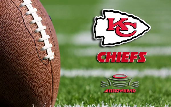 Close-up of an NFL football on grass with the Kansas City Chiefs logo and the word CHIEFS alongside Arrowhead text in this 4K Ultra HD desktop wallpaper.