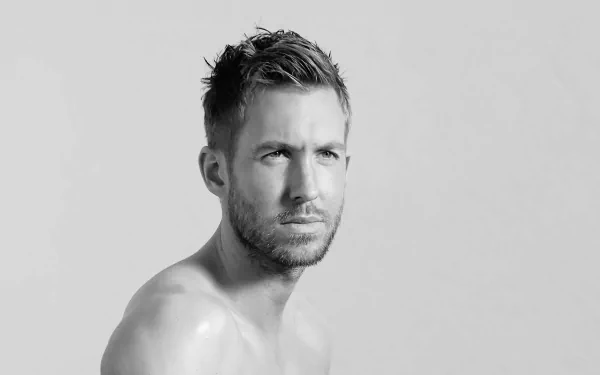 HD desktop wallpaper featuring a monochrome portrait of a shirtless man posing against a neutral background.