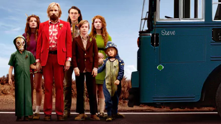 HD PC desktop wallpaper and background from the movie Captain Fantastic showing a rugged family in eclectic clothing lined up beside a blue bus under a clear sky.