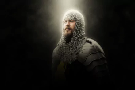 HD desktop wallpaper featuring a medieval knight in detailed chainmail and armor, captured in a striking portrait-style cosplay against a dark, smoky background.