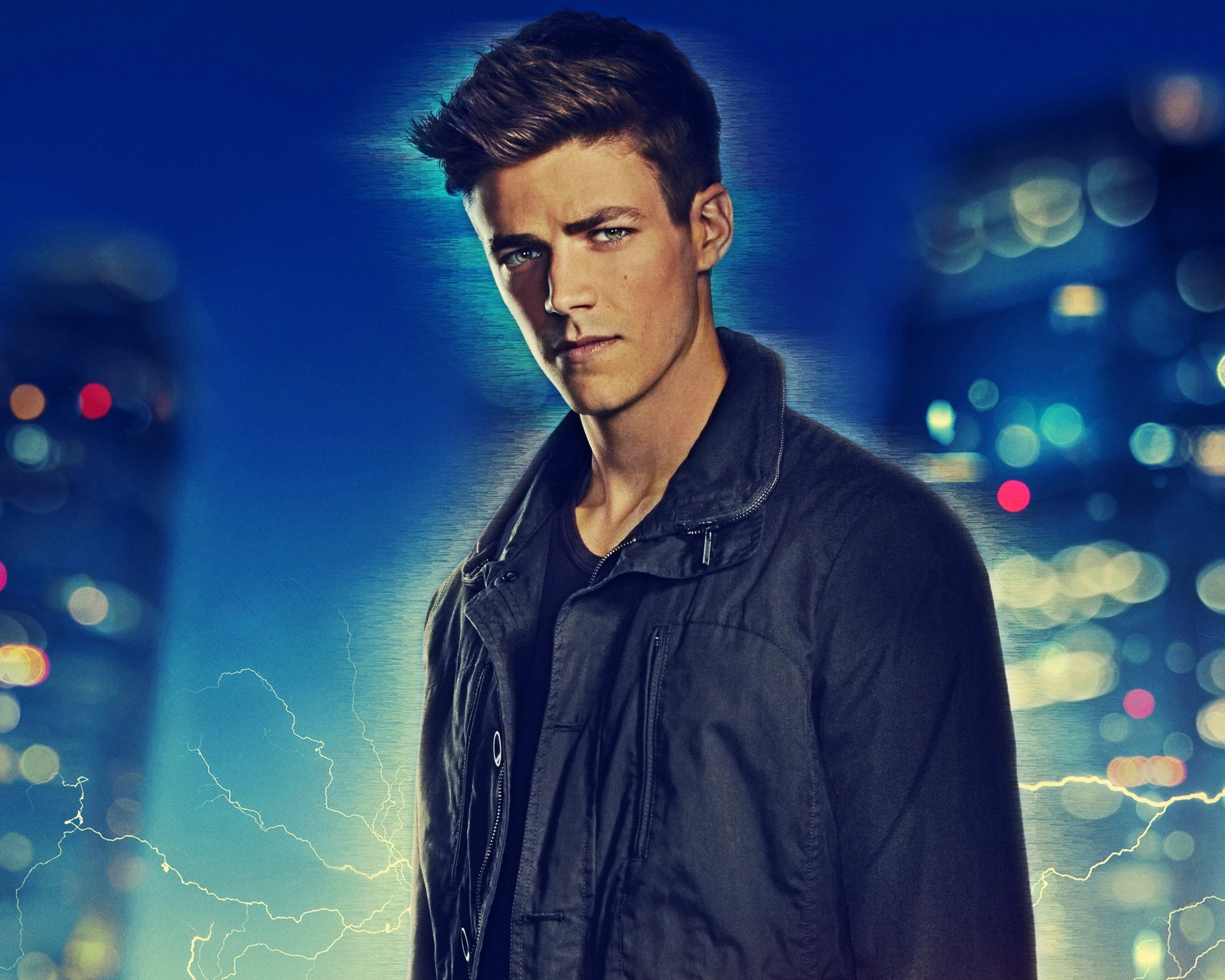 HD desktop wallpaper featuring Grant Gustin as Barry Allen, also known as the Flash, from the TV show The Flash (2014), set against a cityscape background with lightning effects.
