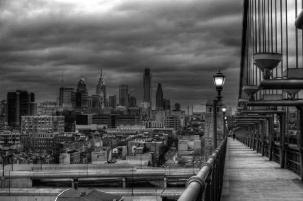 Black and white photography of a city skyline viewed from a bridge, captured in high definition for a PC desktop wallpaper and background.