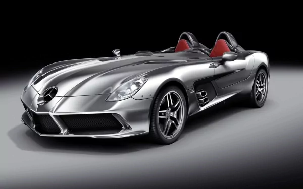 HD desktop wallpaper of a sleek silver Mercedes-Benz SLR McLaren Roadster sports car against a dark gradient background.