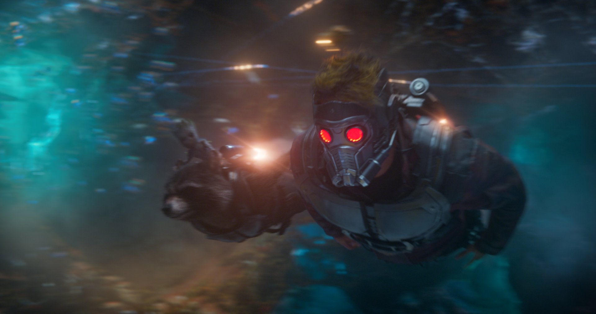 Star-Lord (Peter Quill) from Guardians of the Galaxy Vol. 2 in his mask with glowing red eyes, lunging through neon-lit space — HD PC desktop wallpaper.