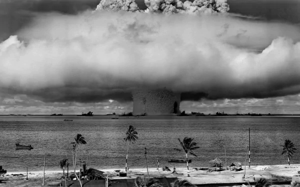 A dramatic black and white image of a nuclear bomb explosion, showcasing military might and the haunting beauty of war, serving as a striking HD desktop wallpaper.
