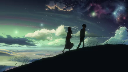 HD desktop wallpaper featuring Takaki Touno and Akari Shinohara from the anime 5 Centimeters per Second, walking on a hill under a starry night sky with glowing clouds and a colorful horizon.