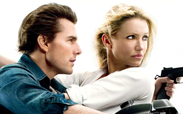 HD desktop wallpaper: promotional shot from the movie Knight and Day showing two actors — a woman aiming a handgun and a man beside her, both looking tense.