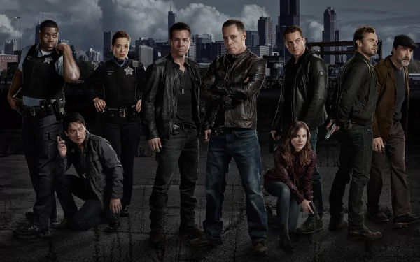 HD desktop wallpaper featuring the cast of Chicago P.D., prominently including Hank Voight, all dressed as police officers against a dark city skyline backdrop.