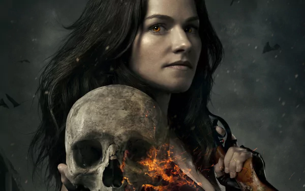 HD desktop wallpaper of a dark-haired woman from the TV show Van Helsing, holding a skull with dark clouds and flying bats in the background.