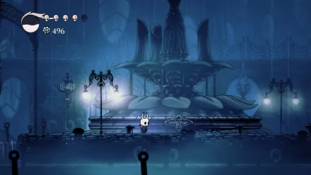 4K Ultra HD PC wallpaper of Hollow Knight, featuring the small knight character standing in a dimly lit, eerie underground area with ornate lampposts and a large statue.