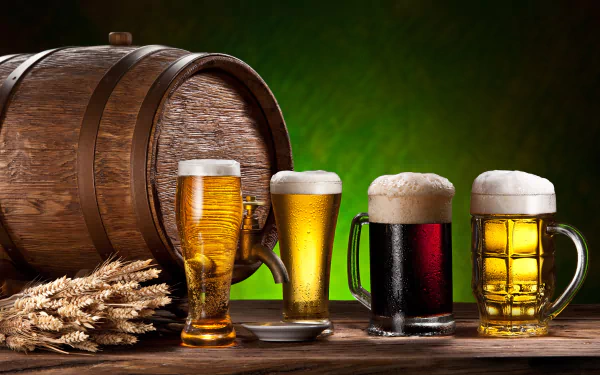HD wallpaper of various beers in glasses and an oak barrel, accented by wheat stalks, against a vibrant green background. The image exudes a classic bar or brewery ambiance.