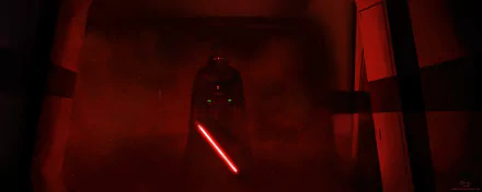 HD PC desktop wallpaper featuring Darth Vader from the movie Rogue One: A Star Wars Story, standing ominously with his red lightsaber glowing in a dark, smoky environment.