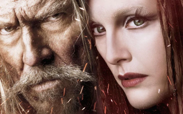 Close-up HD wallpaper of Jeff Bridges and Julianne Moore from the movie Seventh Son, featuring intense expressions and a dark, fiery background.