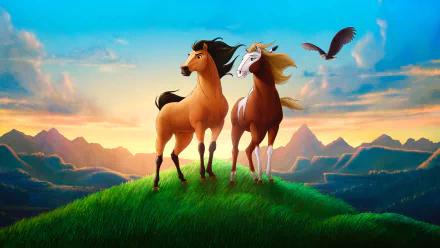 HD PC desktop wallpaper from the movie Spirit: Stallion of the Cimarron, featuring two horses standing on a grassy hilltop at sunset with mountains and an eagle in the background.