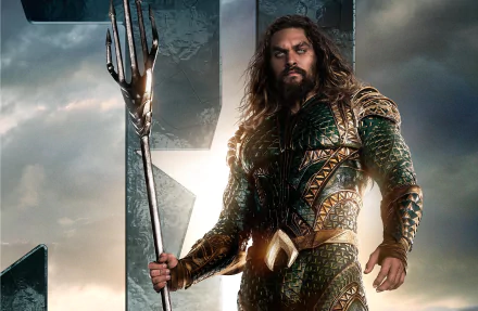 HD desktop wallpaper of Jason Momoa as Aquaman from the Justice League movie, displaying him in his armor holding a trident against a dramatic background.