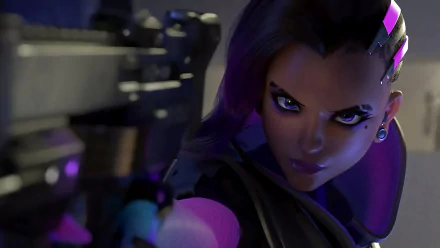 HD PC desktop wallpaper featuring Sombra from the video game Overwatch, showcasing her intense gaze and cybernetic style in a dark, futuristic setting.