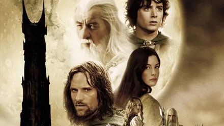 A dramatic HD wallpaper from *The Lord of the Rings: The Two Towers*, featuring iconic characters like Frodo, Aragorn, and Gandalf against a mystical backdrop.