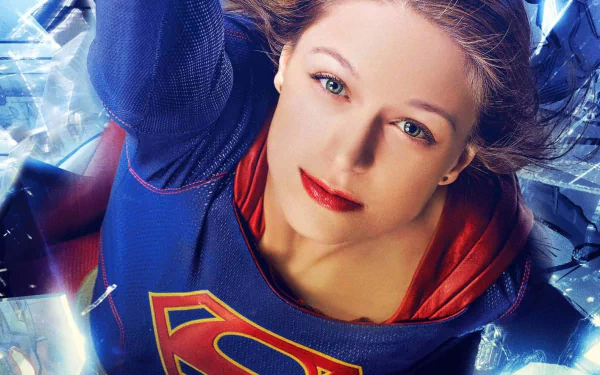 A high-definition desktop wallpaper featuring Melissa Benoist as Supergirl from the TV show Supergirl. The image showcases Supergirl in her iconic suit, appearing strong and determined amidst a dynamic background.