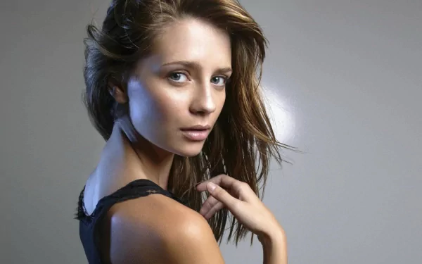 HD PC desktop wallpaper featuring a close-up portrait of celebrity Mischa Barton with a neutral gray background.