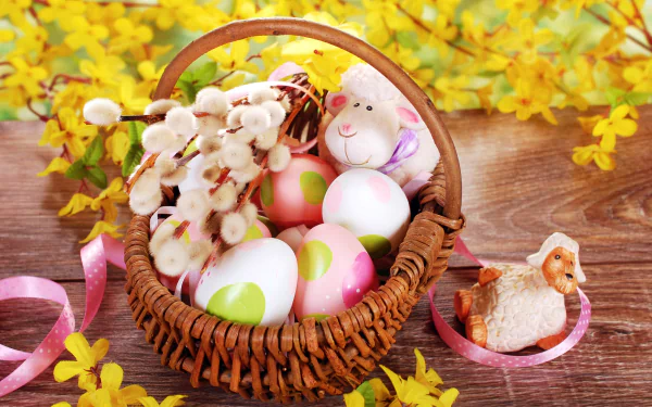 Easter-themed HD desktop wallpaper featuring a basket with colorful eggs, a lamb figurine, a stuffed lamb, and blossoming yellow flowers on a wooden surface.