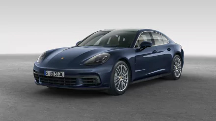 HD desktop wallpaper featuring a sleek dark blue Porsche Panamera car, showcasing its modern design and luxurious appeal against a clean, neutral background.