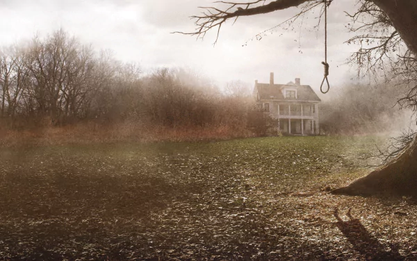 HD PC desktop wallpaper featuring a foggy, eerie landscape with a hanging noose and a distant old house from the movie The Conjuring.