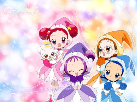 HD PC desktop wallpaper of Ojamajo Doremi anime — five cheerful little witches in colorful outfits posing against a sparkly pastel background