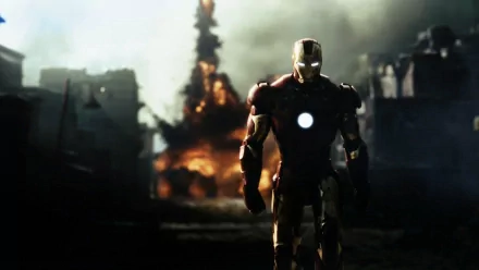 HD wallpaper featuring Tony Stark as Iron Man, walking away from an explosion with a dramatic background, capturing an iconic movie scene.