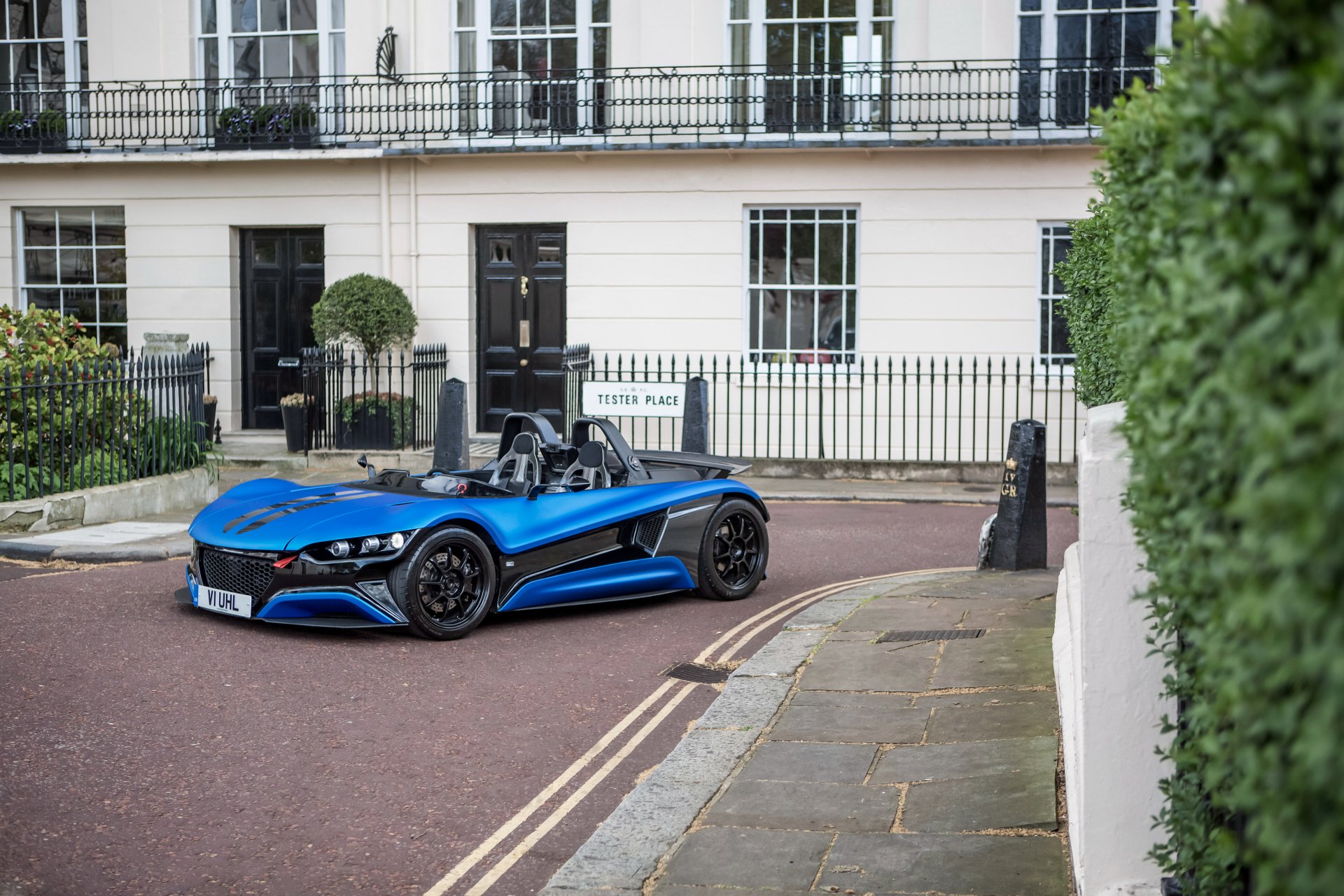 A sleek blue Vauxhall supercar parked on a quiet street, captured in stunning 4K Ultra HD for a PC desktop wallpaper and background.