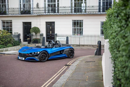A sleek blue Vauxhall supercar parked on a quiet street, captured in stunning 4K Ultra HD for a PC desktop wallpaper and background.