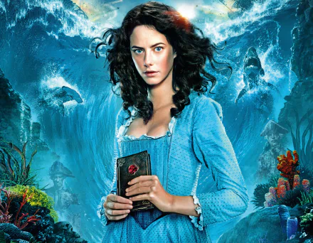 Carina Smyth, portrayed by Kaya Scodelario, stands confidently against a vivid underwater backdrop in this stunning 4K Ultra HD wallpaper from *Pirates of the Caribbean: Dead Men Tell No Tales*.