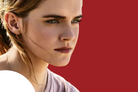 Close-up of Emma Watson's face from the movie The Circle, featured as an HD PC desktop wallpaper with a solid red background.
