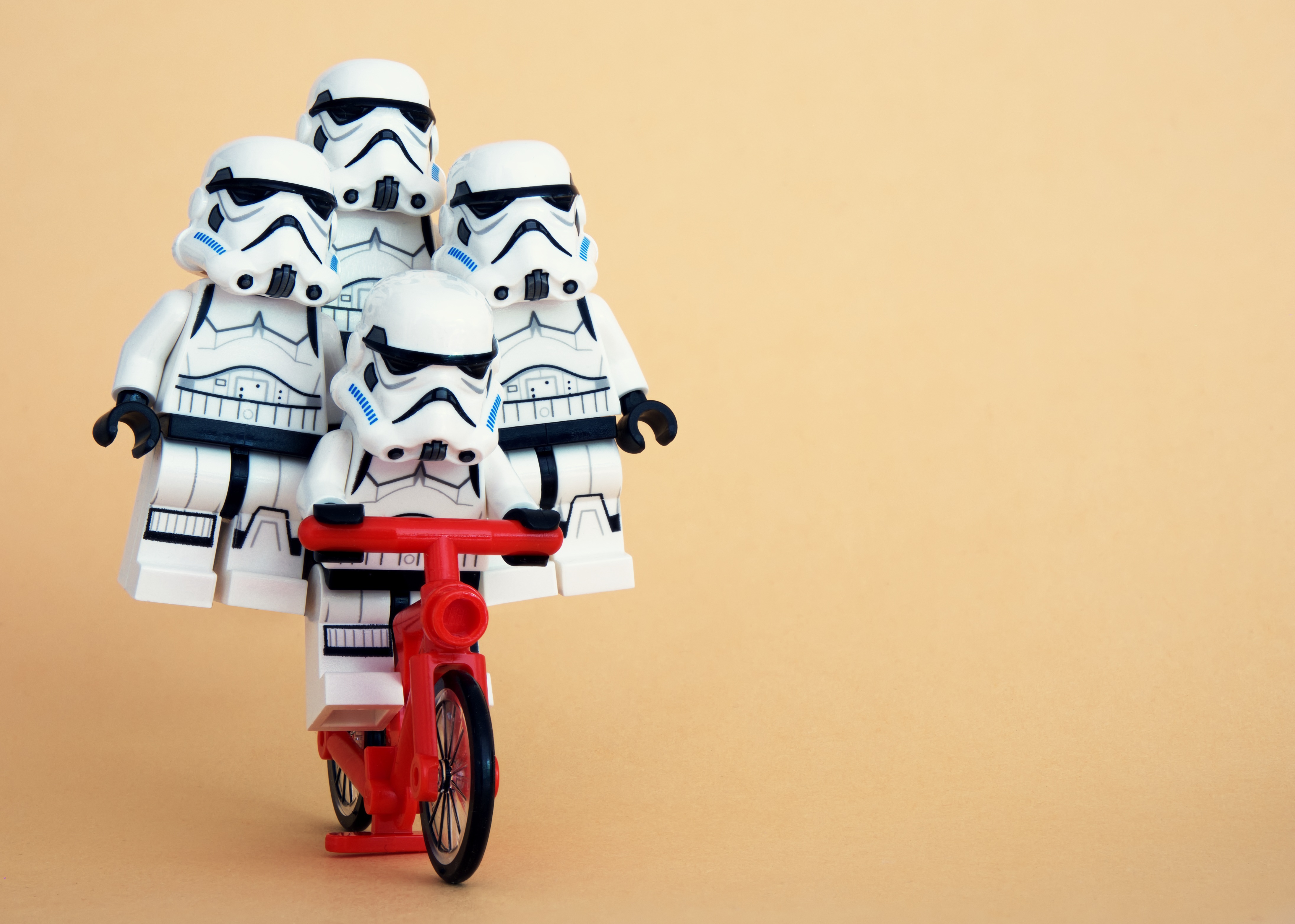 Four Stormtroopers balanced on a Bike 4k Ultra HD Wallpaper