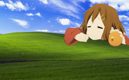 HD wallpaper featuring Yui Hirasawa from the anime K-ON!, with a lush green field and blue sky background.